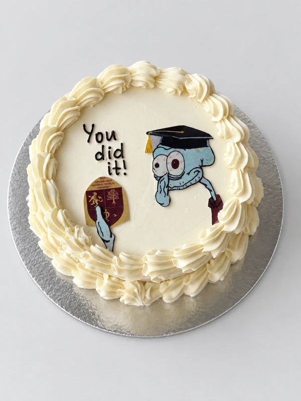 Торт "You did it" — Торт «You did it» — светлый поздравительный торт с надписью You did it и забавными рисованными героями.